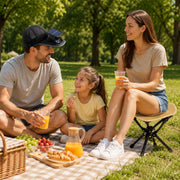 Family picnic scene using Trail Natural portable folding camping stools